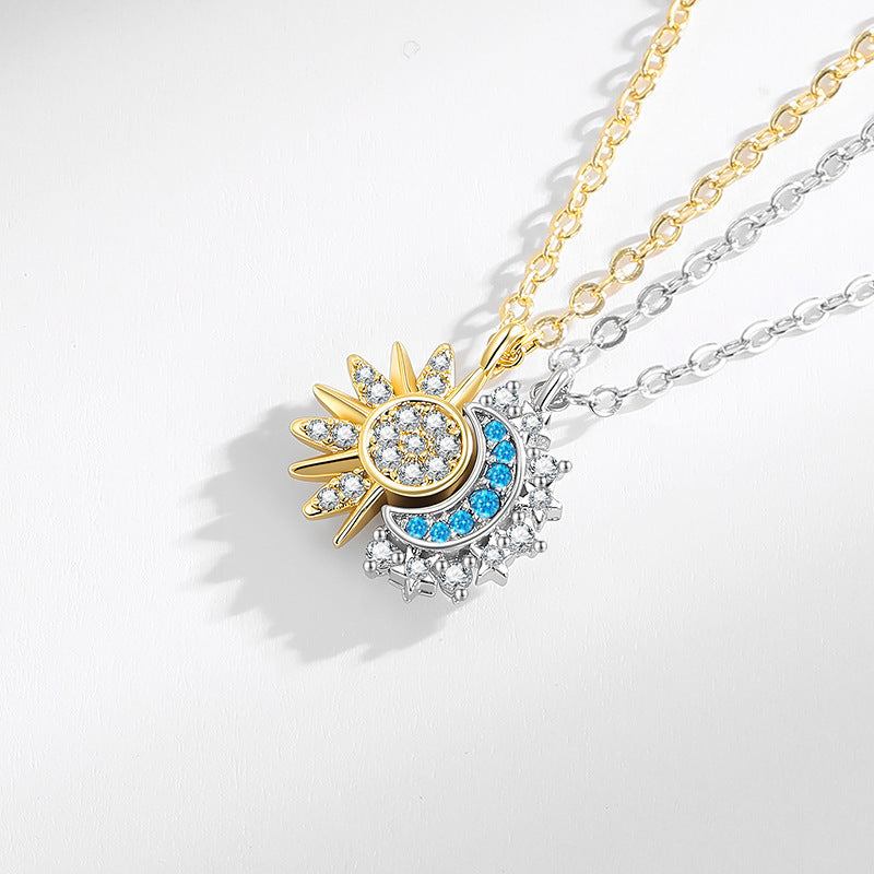 Magnetic sun and moon pendant necklace set displayed on a white background
