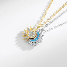 Magnetic sun and moon pendant necklace set displayed on a white background