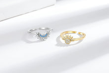 Gold-tone sun ring and silver-tone moon ring displayed on a white background