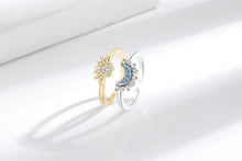 Gold-tone sun ring and silver-tone moon ring displayed side by side