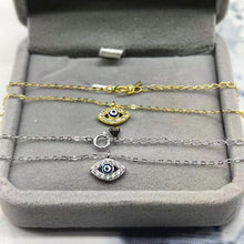 Gold-tone and silver-tone evil eye pendant necklaces with extender chains