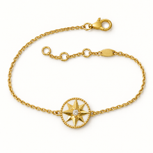 Gold-tone white-inlay eight-point compass star bracelet with lobster clasp and extender