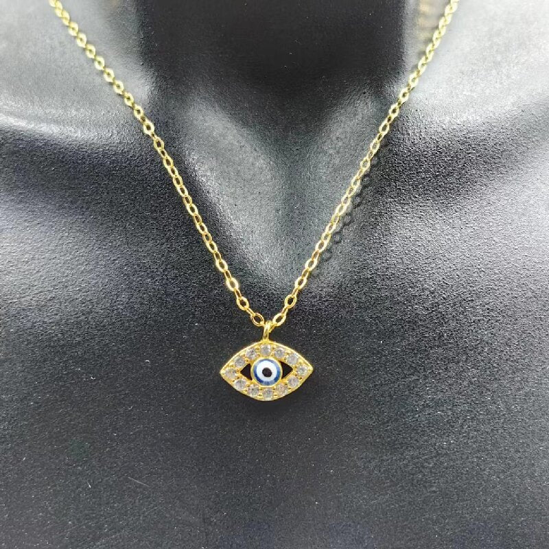 Gold-tone evil eye pendant necklace close-up