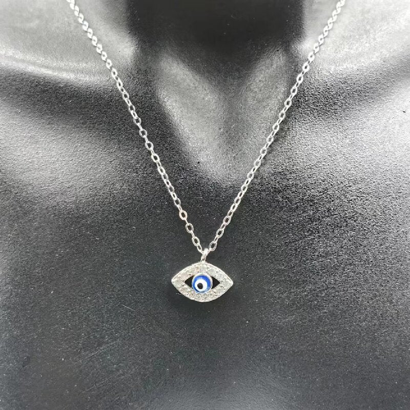 Silver-tone evil eye pendant necklace close-up
