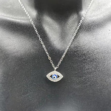 Silver-tone evil eye pendant necklace close-up