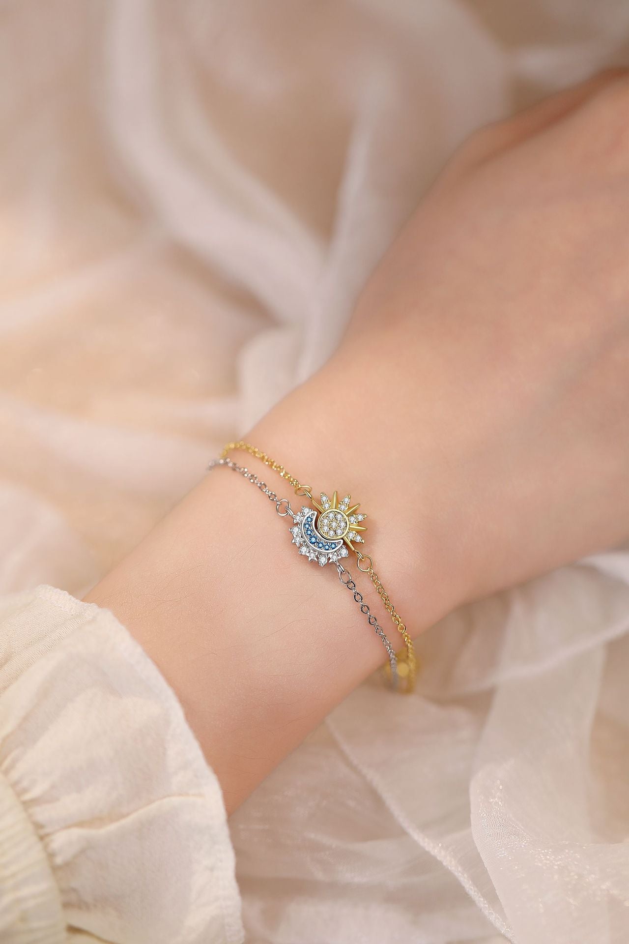 Celestial sun and moon bracelet set worn on a wrist