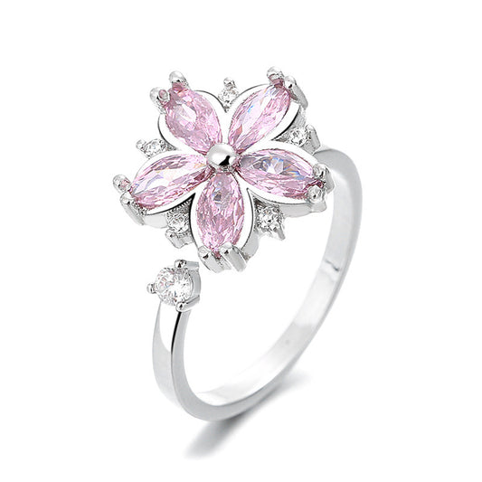 Pink Blossom Spinner Ring with an open band