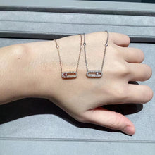Rose gold and silver-tone pavé open link necklaces shown together