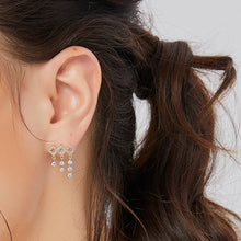 Boucles d'oreilles à pampilles géométriques en diamant 
