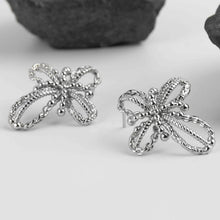 Boucles d'oreilles tressées créatives à fleurs creuses 