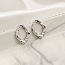 Boucles d'oreilles irrégulières 