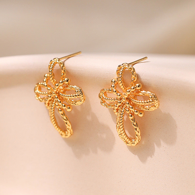 Boucles d'oreilles tressées créatives à fleurs creuses 