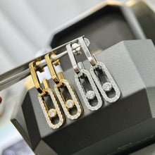Pavé CZ open link drop earrings in silver and gold-tone finishes