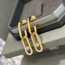 18K gold-tone CZ open link drop earrings shown from an angle