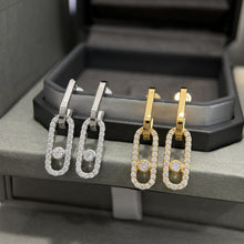 Silver and gold-tone pavé CZ open link drop earrings with sliding stones
