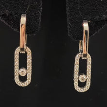 Rose gold-tone pavé CZ open link drop earrings on black display