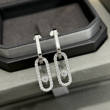 Silver-tone pavé CZ open link drop earrings displayed as a pair