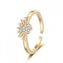 Gold-tone adjustable open ring with a sun motif on a white background
