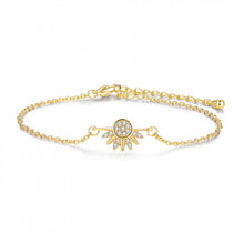 Gold-tone sun motif bracelet with zircon accents on a white background