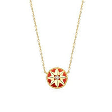 Gold-tone red-inlay eight-point star compass pendant necklace on a white background