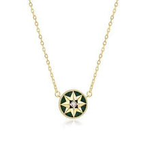 Gold-tone green-inlay eight-point star compass pendant necklace on a white background