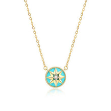 Gold-tone turquoise-inlay eight-point star compass pendant necklace on a white background