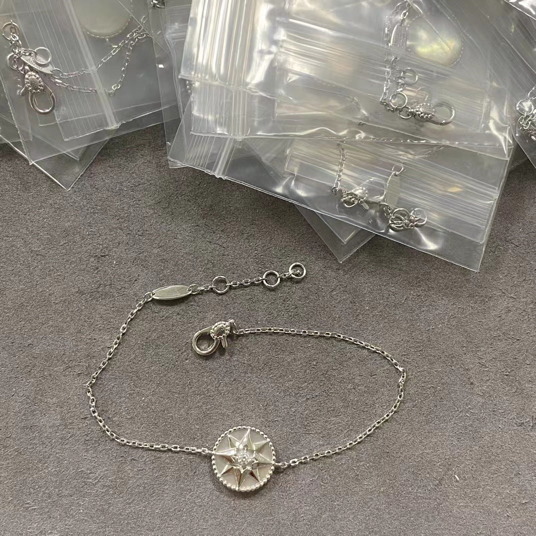 Silver-tone white-inlay eight-point star compass bracelet with an adjustable chain
