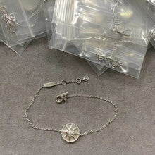 Silver-tone white-inlay eight-point star compass bracelet with an adjustable chain
