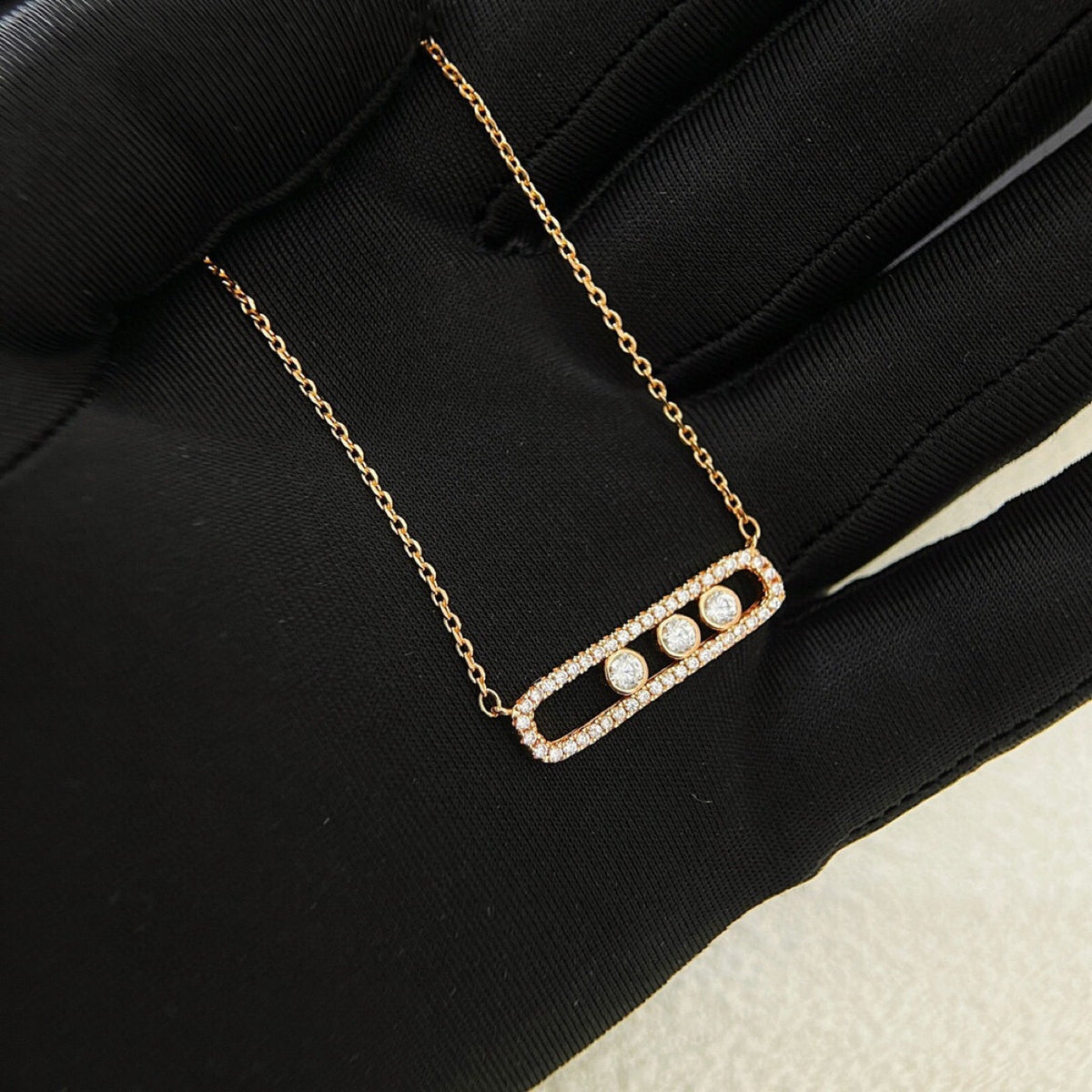 Rose gold-tone pavé CZ sliding bar necklace with three stones