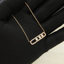 Rose gold-tone pavé CZ sliding bar necklace with three stones