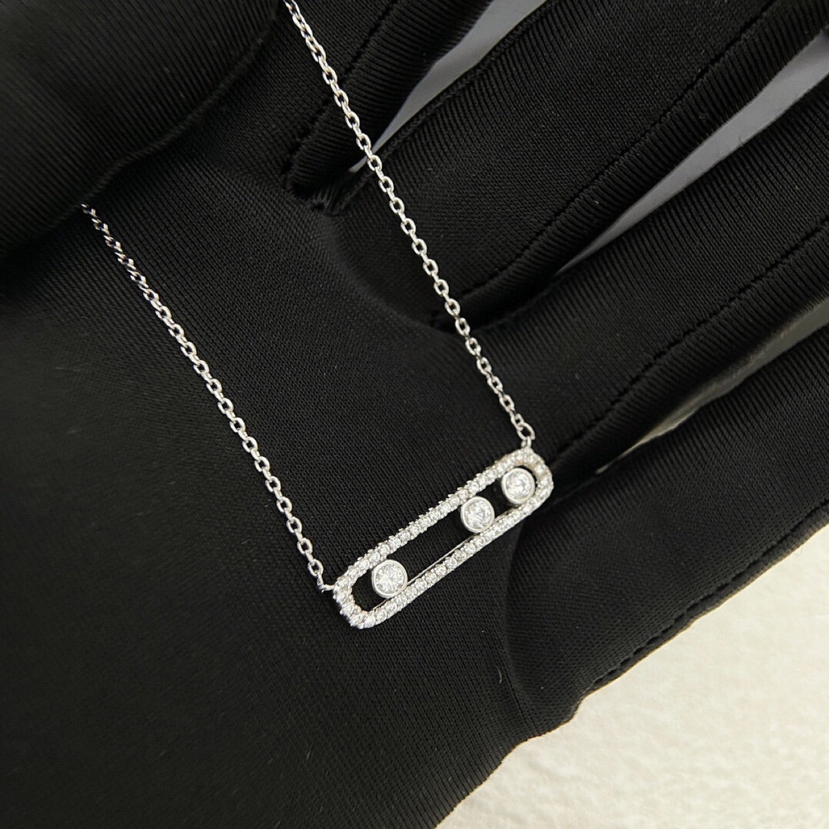 Silver-tone pavé CZ sliding bar necklace with three stones