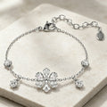 Crystal Snowflake Charm Bracelet in Silver Tone