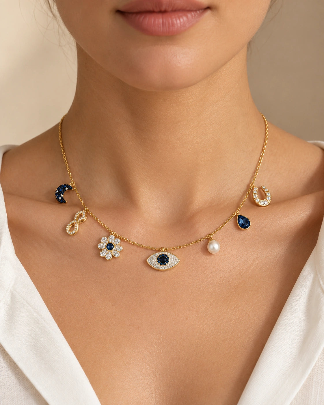 Celestial Evil Eye Multi-Charm Necklace – Gold Tone on a model, seven-charm front view