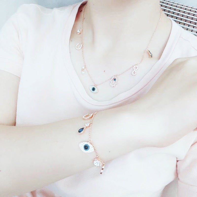 Celestial Evil Eye Multi-Charm Necklace in rose gold tone – supplied wearing photo shown with matching bracelet