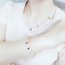 Celestial Evil Eye Multi-Charm Necklace in rose gold tone – supplied wearing photo shown with matching bracelet