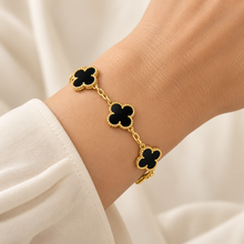Five-clover bracelet – Black and Gold, worn alone on wrist