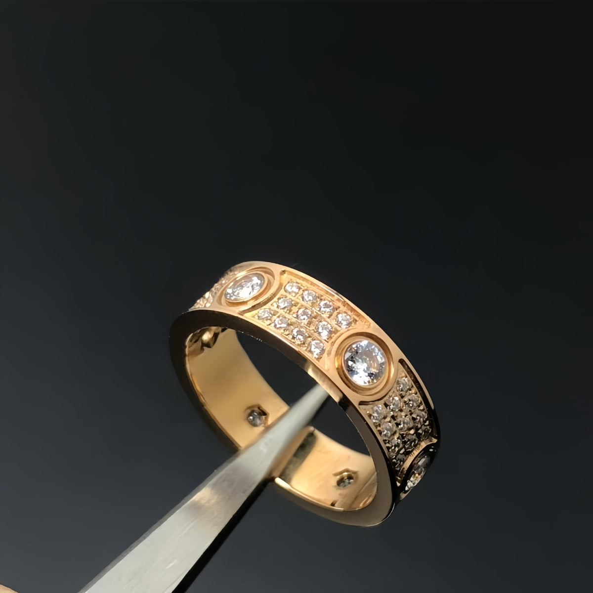 Rose-gold-tone round-set cubic zirconia pave band ring held with tweezers - photo 15