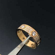 Rose-gold-tone round-set cubic zirconia pave band ring held with tweezers - photo 15
