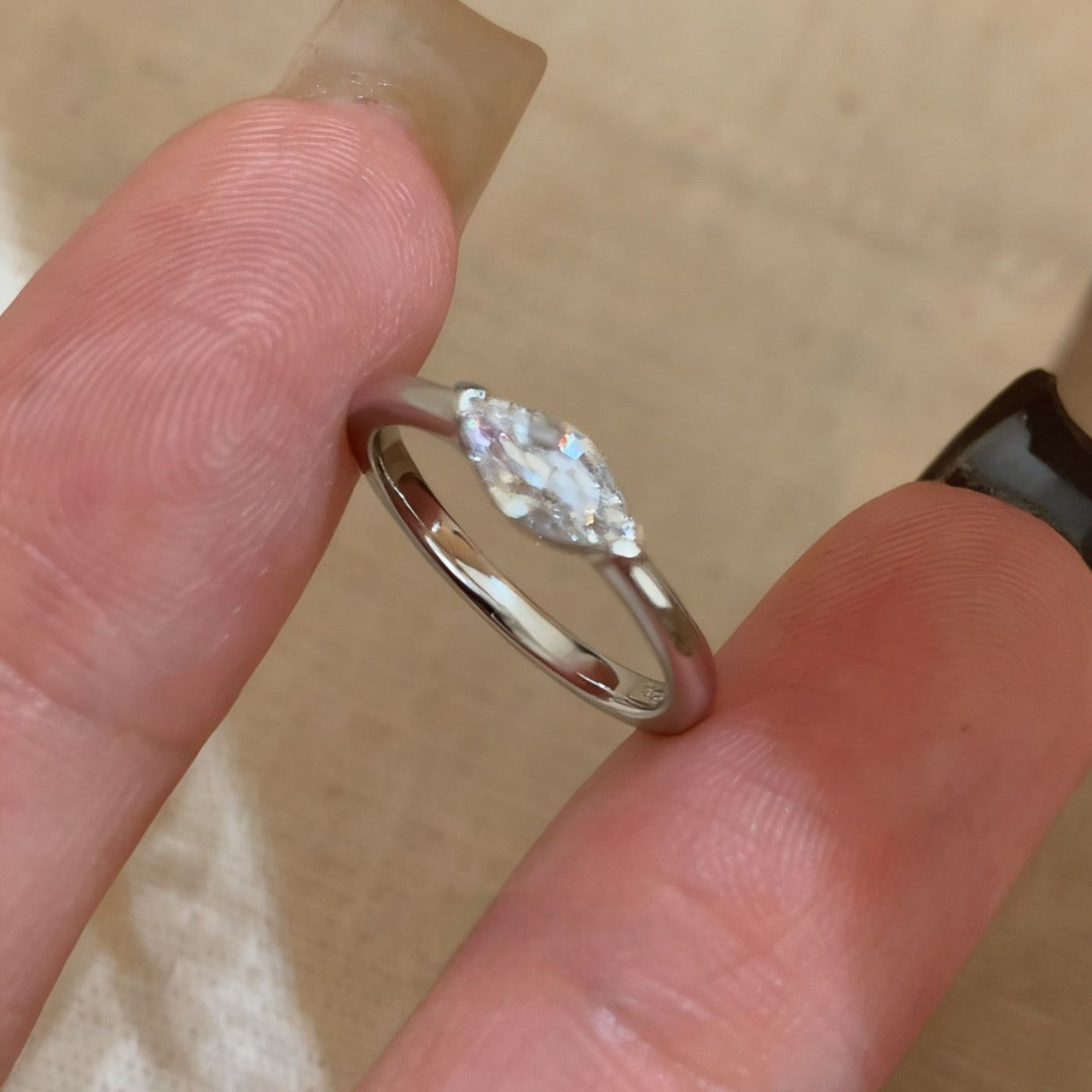 Silver-tone marquise cubic zirconia pinky ring close-up