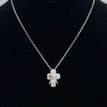 Silver-tone pave flower doll pendant necklace on a black display bust - photo 16