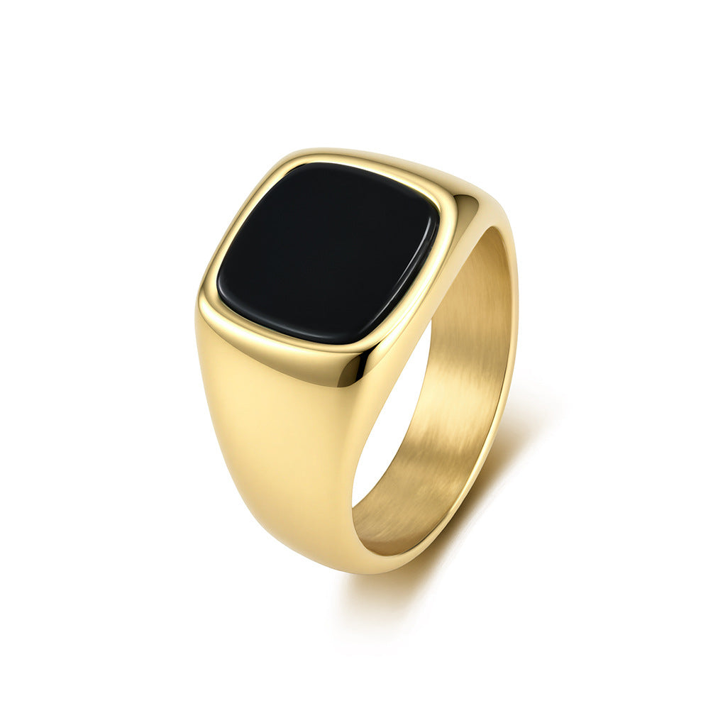 Gold tone men's stainless steel signet ring with natural black stone