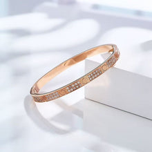 Rose gold tone two-row cubic zirconia screw motif bangle