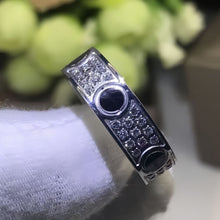 Silver-tone pave band ring with black circular accents close up - photo 03