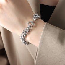 Silver tone chunky toggle chain bracelet worn on wrist