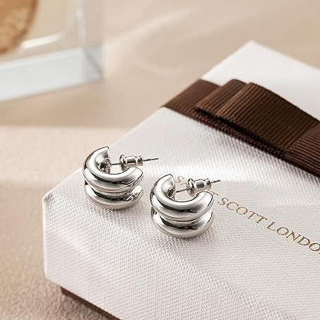 Silver tone layered C-hoop earrings detail