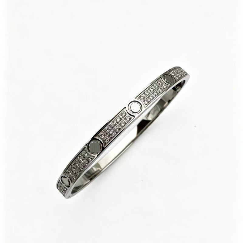 Silver tone three-row cubic zirconia screw motif bangle