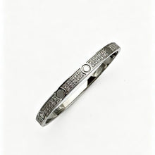 Silver tone three-row cubic zirconia screw motif bangle