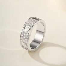 Silver-tone three-row pave circle-motif ring on an ivory background - photo 41