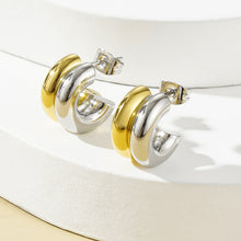Two tone stainless steel C-hoop earrings close-up