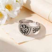 Antique Silver fleur-de-lis ring in a warm lifestyle setting